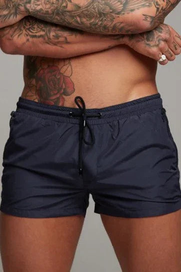 Good Trouble Garments short sexy swim trunks in navy blue with drawstring waist for men