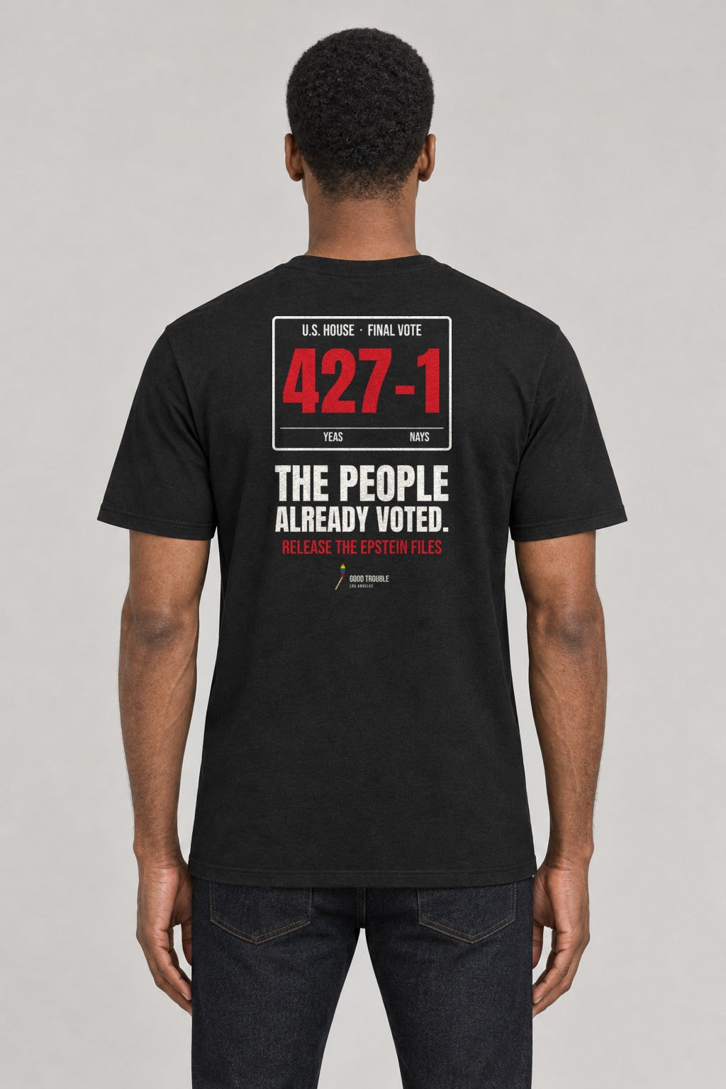 427–1 Release the Epstein Files Tee in Black, back view showing the 427–1 vote tally back print, on an athletic model wearing size L, 6'0" - Good Trouble Fashion