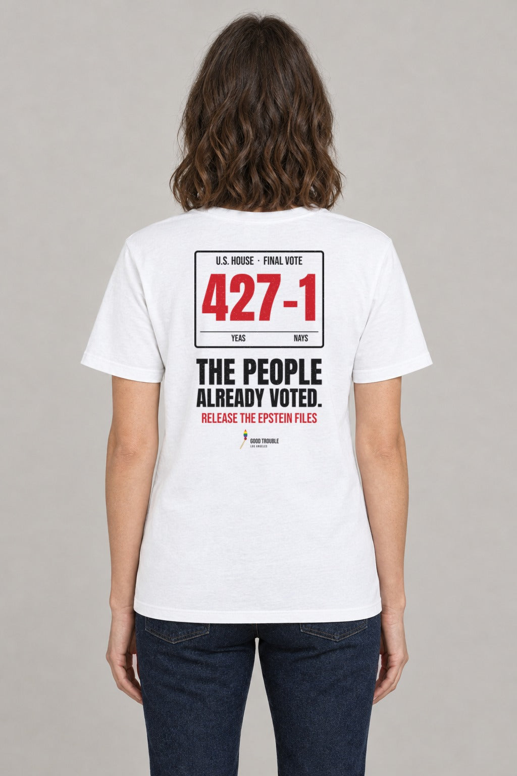427–1 Release the Epstein Files Tee in White, back view showing the 427–1 vote tally back print, on a slim model wearing size S, 5'8" - Good Trouble Fashion