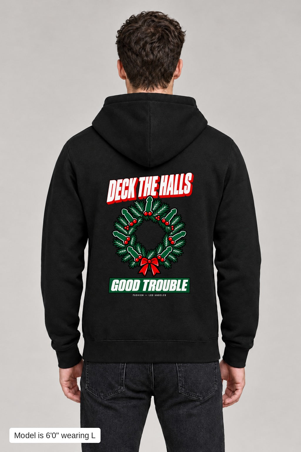 Deck the Halls Hoodie in Black, back view with Street Bold wreath print, model is 6'0" wearing L
