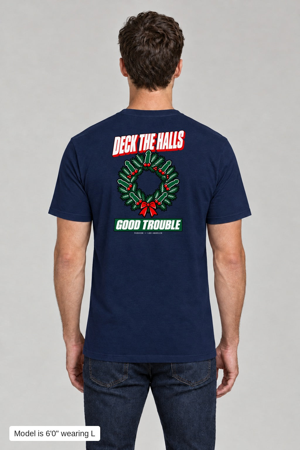Deck the Halls Tee in Navy, back view with Street Bold wreath print, model is 6'0" wearing L