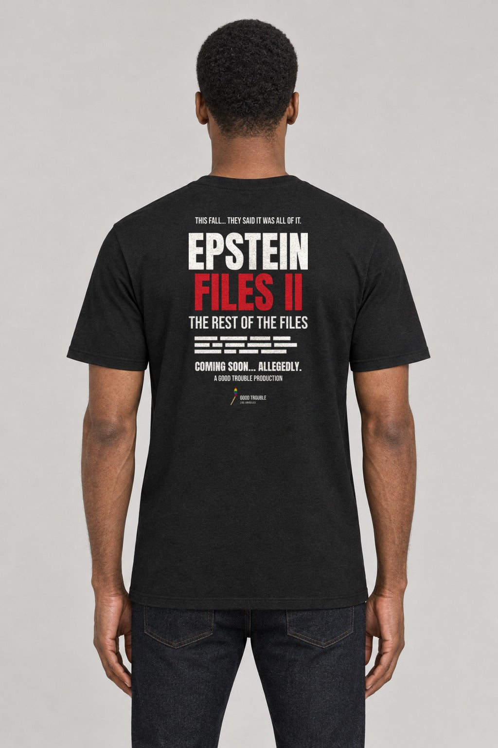 Epstein Files II Sequel Tee in Black, back view showing the EPSTEIN FILES II movie-poster back print, on an athletic model wearing size L, 6'0" - Good Trouble Fashion