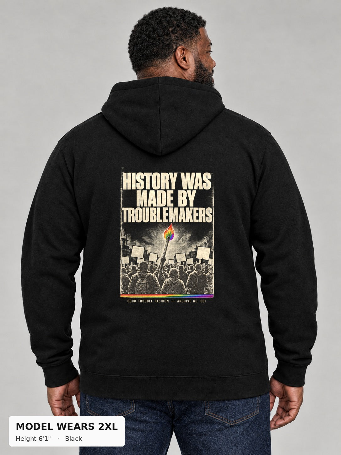 Good Trouble Archive 001 Hoodie in Black, back view showing the HISTORY WAS MADE BY TROUBLEMAKERS poster back print, on a plus-size model wearing size 2XL, 6'1" - Good Trouble Fashion