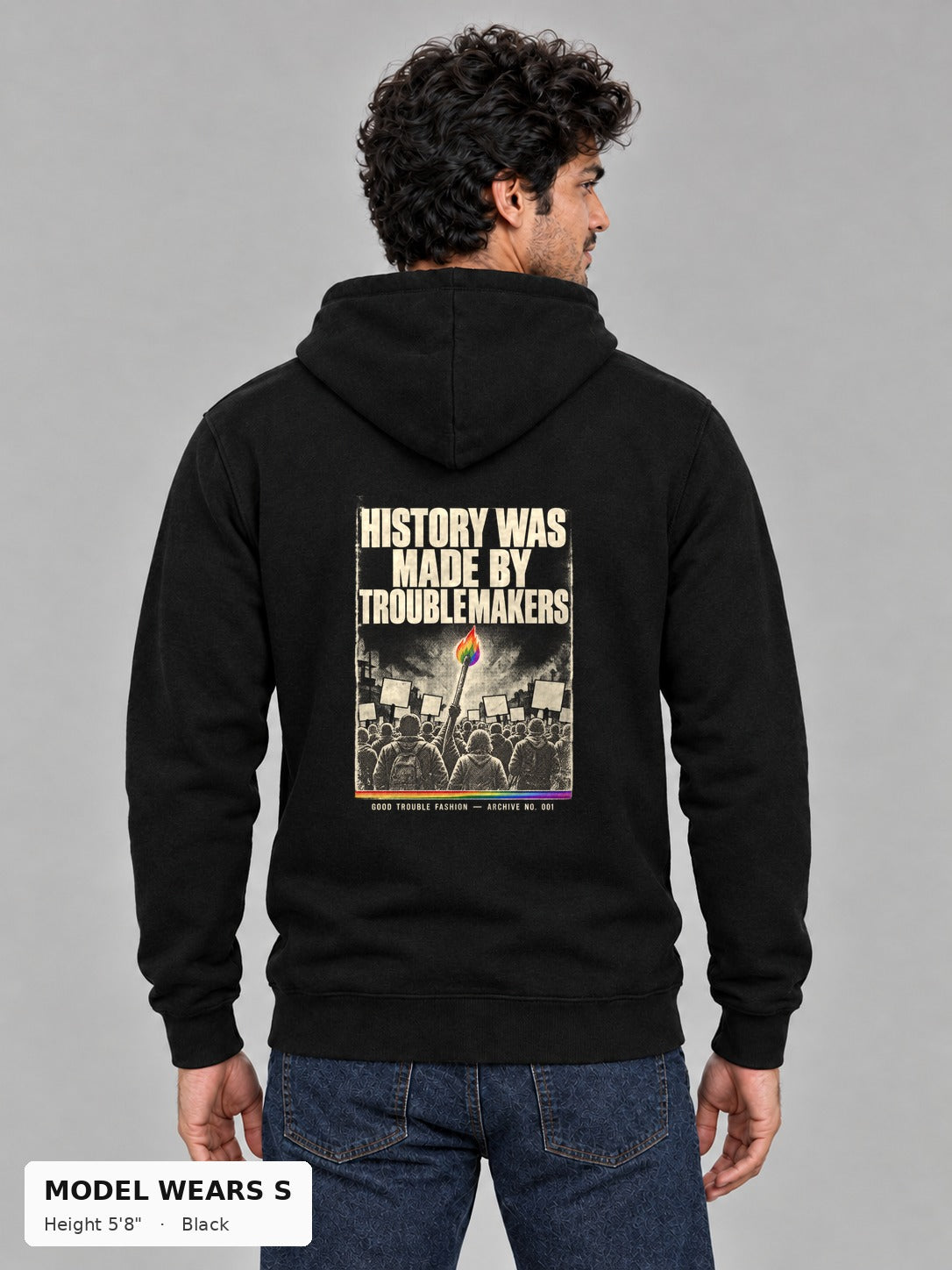 Good Trouble Archive 001 Hoodie in Black, back view showing the HISTORY WAS MADE BY TROUBLEMAKERS poster back print, on a slim model wearing size S, 5'8" - Good Trouble Fashion