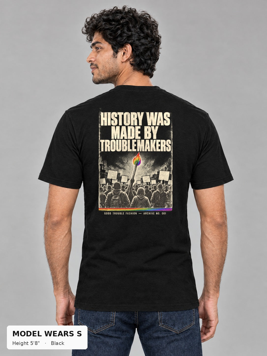 Good Trouble Archive 001 Tee in Black, back view showing the HISTORY WAS MADE BY TROUBLEMAKERS poster back print, on a slim model wearing size S, 5'8" - Good Trouble Fashion