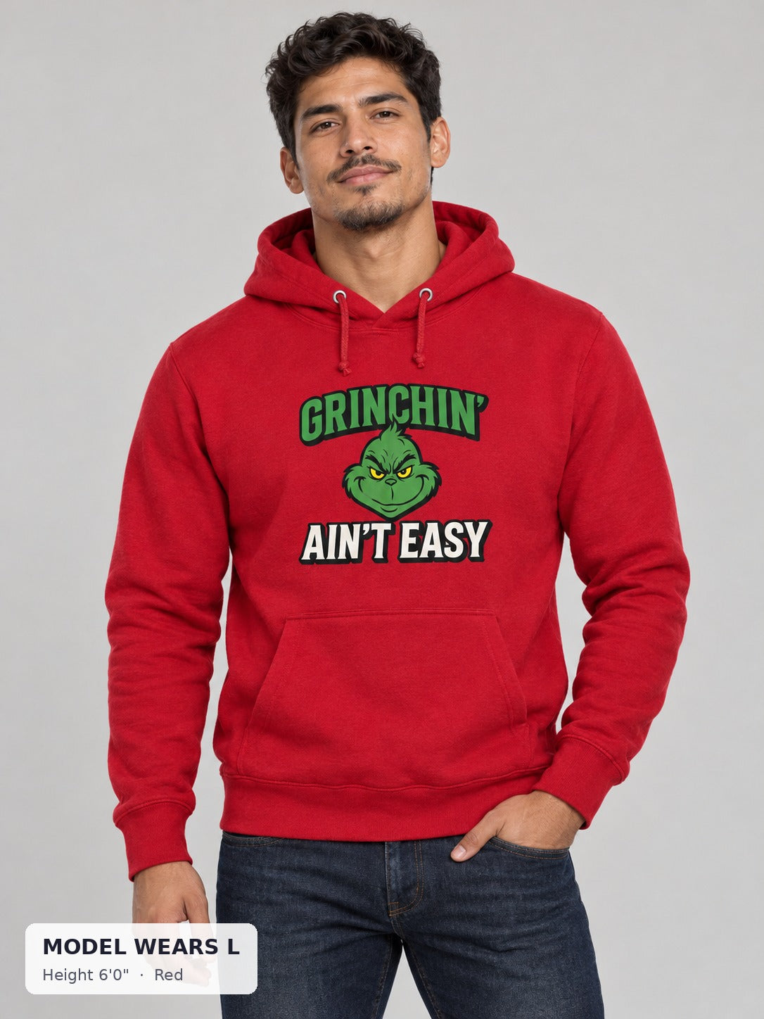 Grinchin' Ain't Easy Hoodie in Red on an athletic model wearing size L, 6'0" - Good Trouble Fashion