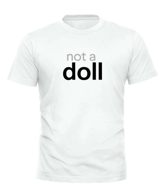 Not a Doll T Shirt - Unique Trendsetter Tee for – unisex graphic cotton T-shirt from Good Trouble Fashion – soft jersey tee product photo