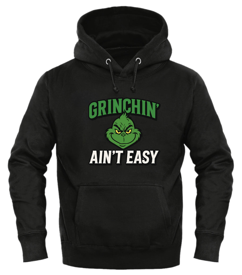 Grinchin' Ain't Easy Hoodie by Good Trouble in black featuring a playful Grinch graphic