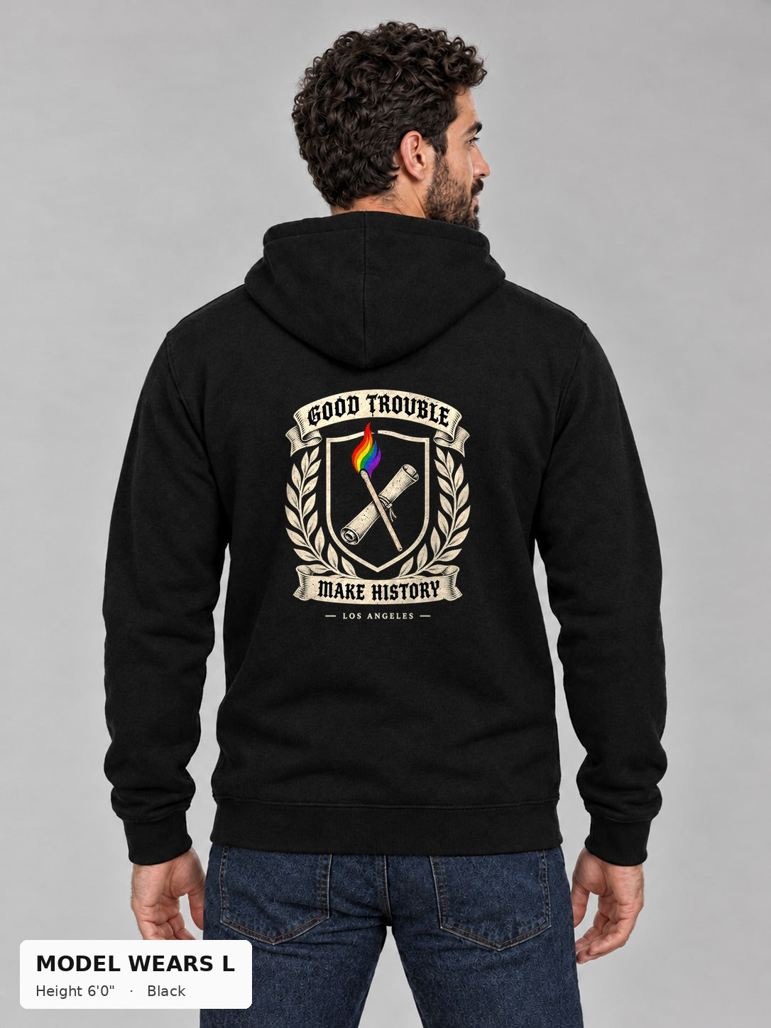 Good Trouble Heritage Crest Hoodie in Black, back view showing the GOOD TROUBLE Make History crest back print, on an athletic model wearing size L, 6'0" - Good Trouble Fashion