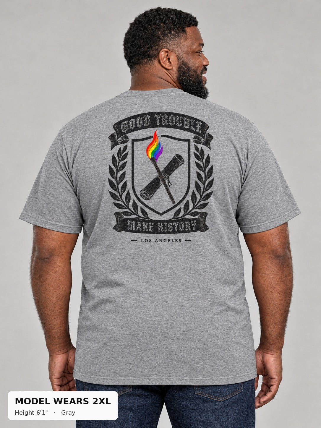Good Trouble Heritage Crest Tee in Gray, back view showing the GOOD TROUBLE Make History crest back print, on a plus-size model wearing size 2XL, 6'1" - Good Trouble Fashion