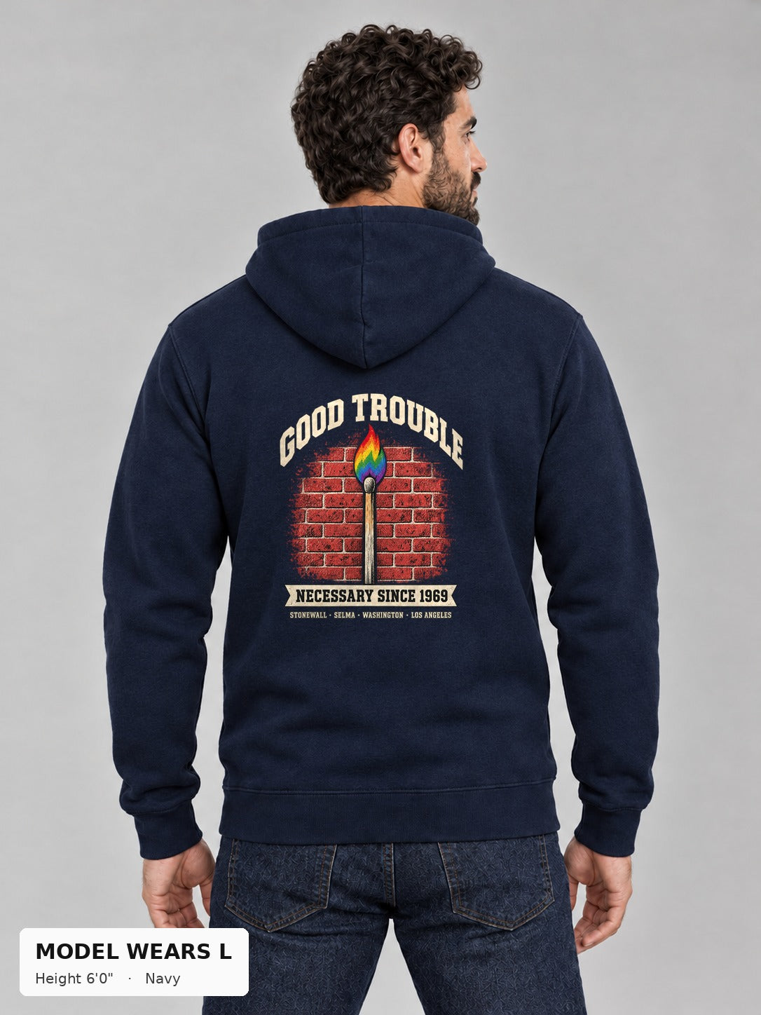 Good Trouble Necessary Since 1969 Hoodie in Navy, back view showing the GOOD TROUBLE brick-wall match back print, on an athletic model wearing size L, 6'0" - Good Trouble Fashion