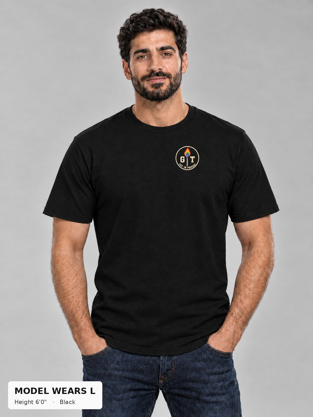 Good Trouble Necessary Since 1969 Tee in Black, front view showing the GT Est. in Protest chest badge, on an athletic model wearing size L, 6'0" - Good Trouble Fashion
