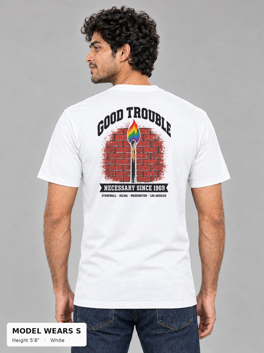 Good Trouble Necessary Since 1969 Tee in White, back view showing the GOOD TROUBLE brick-wall match back print, on a slim model wearing size S, 5'8" - Good Trouble Fashion