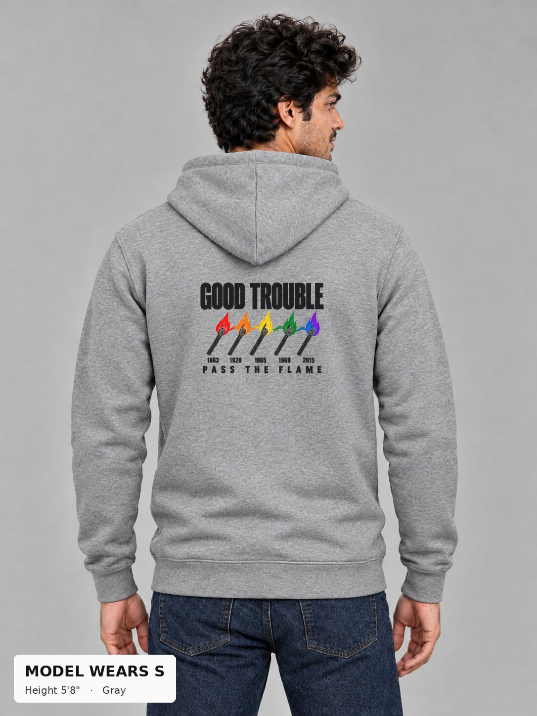 Good Trouble Pass the Flame Hoodie in Gray, back view showing the PASS THE FLAME five-match back print, on a slim model wearing size S, 5'8" - Good Trouble Fashion