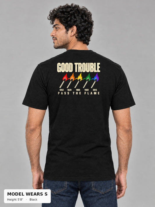 Good Trouble Pass the Flame Tee in Black, back view showing the PASS THE FLAME five-match back print, on a slim model wearing size S, 5'8" - Good Trouble Fashion