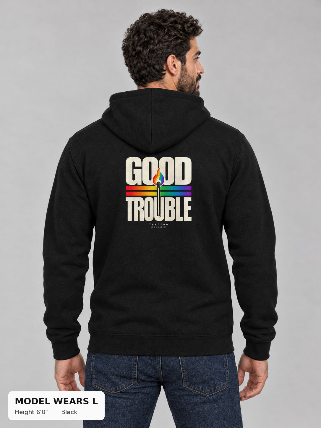 Good Trouble Spark Hoodie in Black, back view showing the GOOD TROUBLE rainbow match back print, on an athletic model wearing size L, 6'0" - Good Trouble Fashion