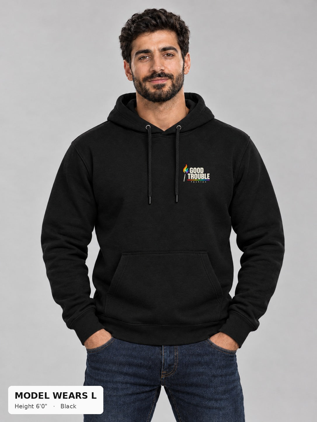 Good Trouble Spark Hoodie in Black, front view showing the left-chest match logo, on an athletic model wearing size L, 6'0" - Good Trouble Fashion