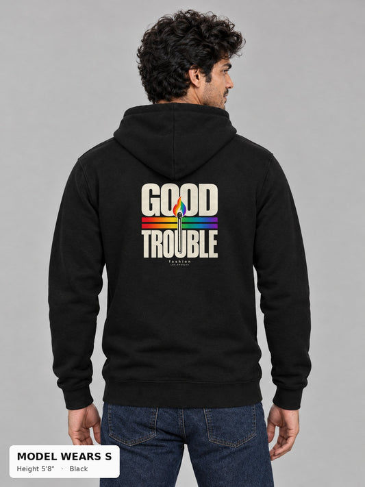 Good Trouble Spark Hoodie in Black, back view showing the GOOD TROUBLE rainbow match back print, on a slim model wearing size S, 5'8" - Good Trouble Fashion