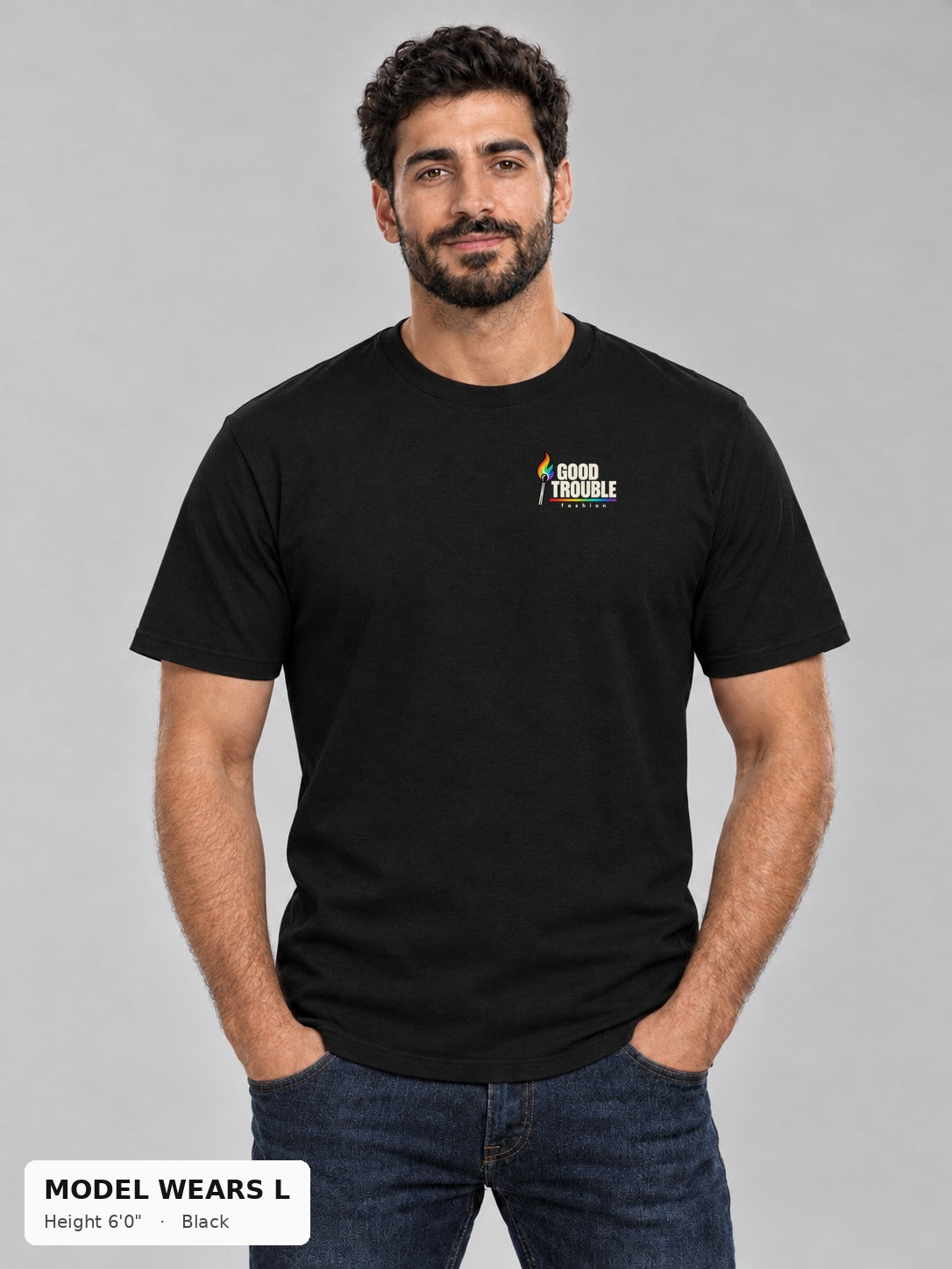 Good Trouble Spark Tee in Black, front view showing the left-chest match logo, on an athletic model wearing size L, 6'0" - Good Trouble Fashion