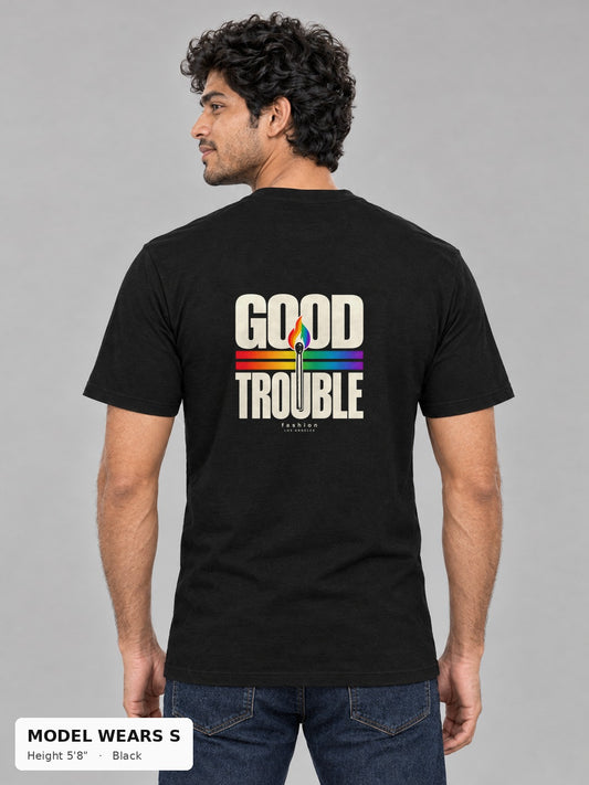 Good Trouble Spark Tee in Black, back view showing the GOOD TROUBLE rainbow match back print, on a slim model wearing size S, 5'8" - Good Trouble Fashion