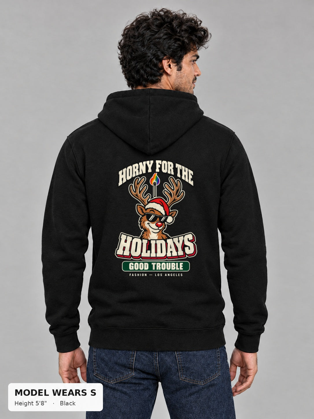 Horny for the Holidays Hoodie in Black, back view showing the HORNY FOR THE HOLIDAYS reindeer back print, on a slim model wearing size S, 5'8" - Good Trouble Fashion