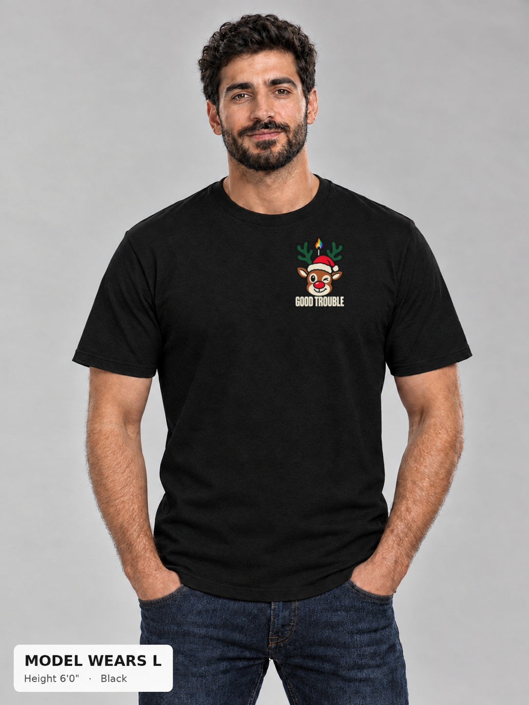 Horny for the Holidays Tee in Black, front view showing the left-chest winking reindeer logo, on an athletic model wearing size L, 6'0" - Good Trouble Fashion