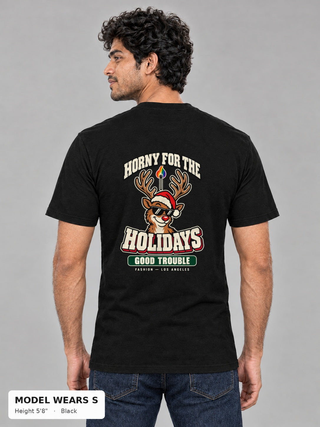 Horny for the Holidays Tee in Black, back view showing the HORNY FOR THE HOLIDAYS reindeer back print, on a slim model wearing size S, 5'8" - Good Trouble Fashion