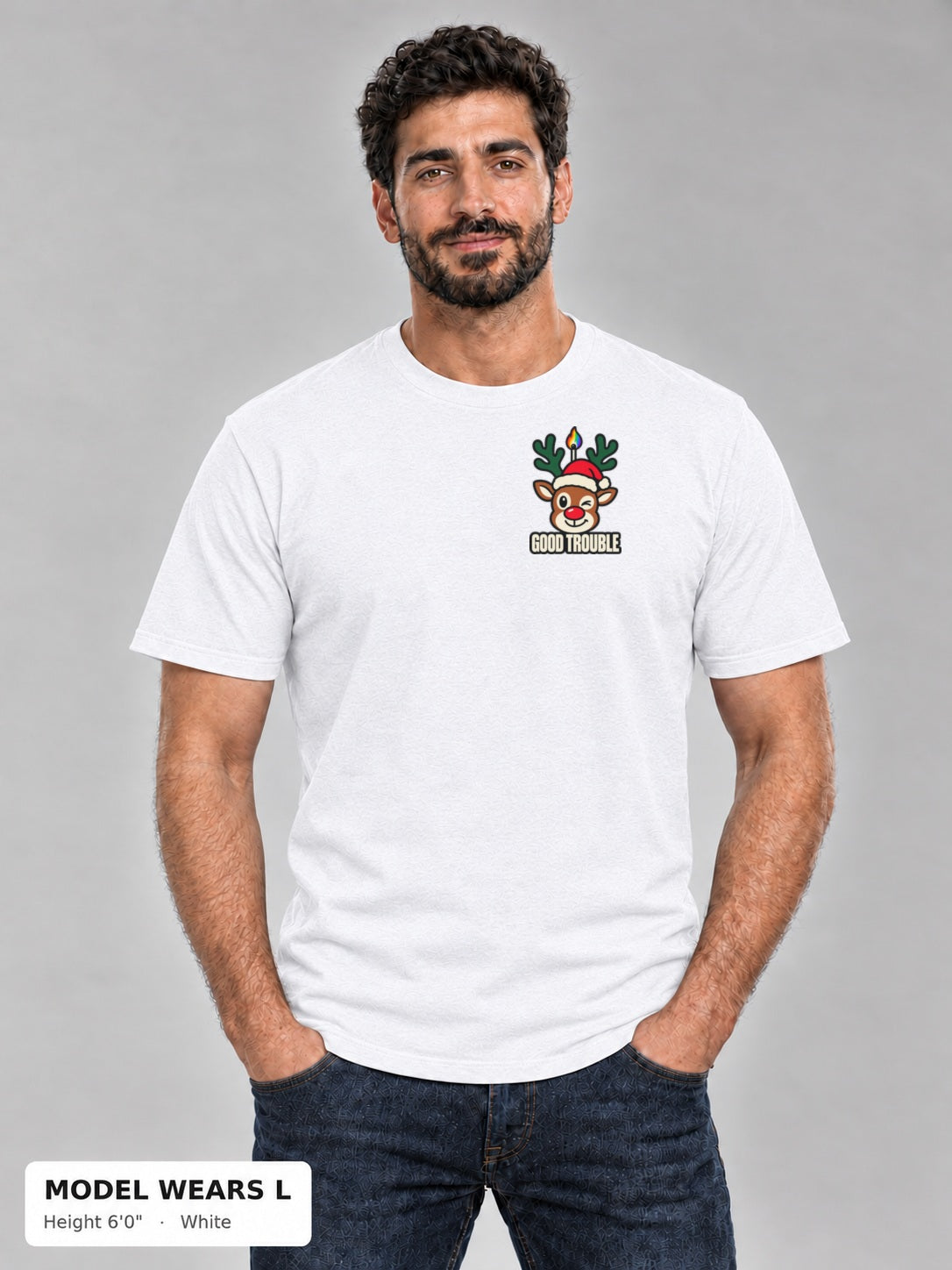 Horny for the Holidays Tee in White, front view showing the left-chest winking reindeer logo, on an athletic model wearing size L, 6'0" - Good Trouble Fashion