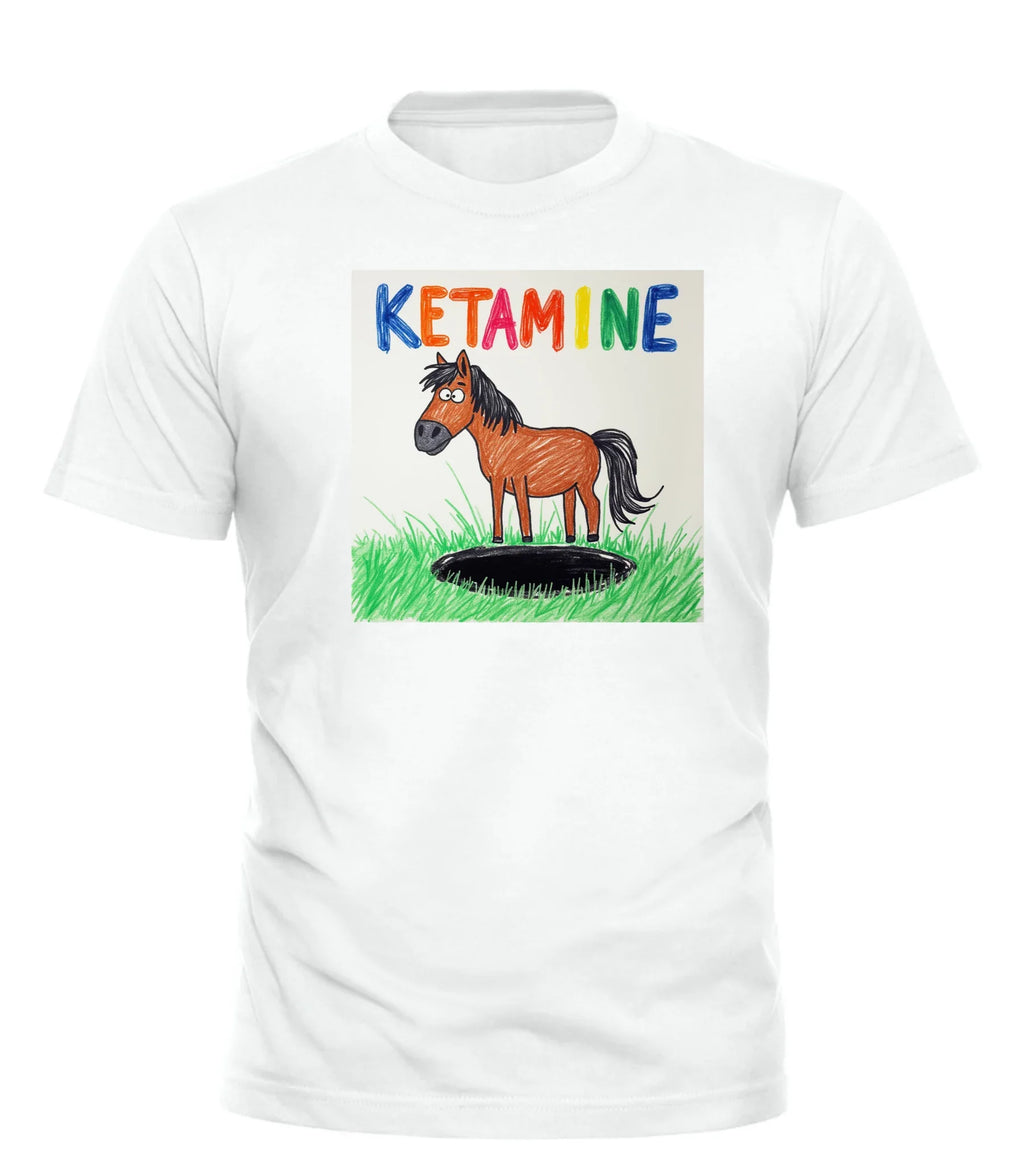 White ketamine horse t-shirt by Good Trouble Garments featuring colorful text and cartoon horse standing on grass