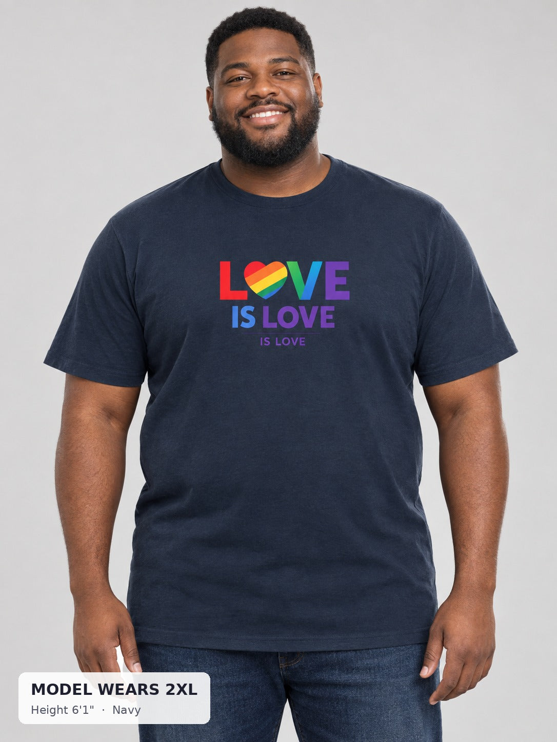 Love Is Love Rainbow Heart Tee in Navy on a plus-size model wearing size 2XL, 6'1" - Good Trouble Fashion