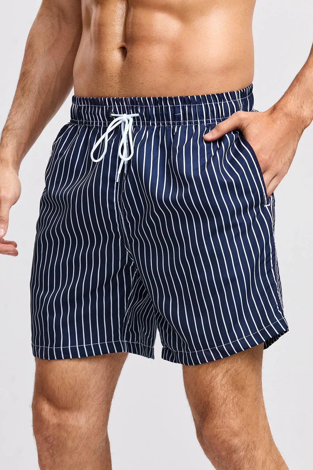 Men's striped swim shorts in navy blue with white stripes and elastic waistband for beach and pool wear
