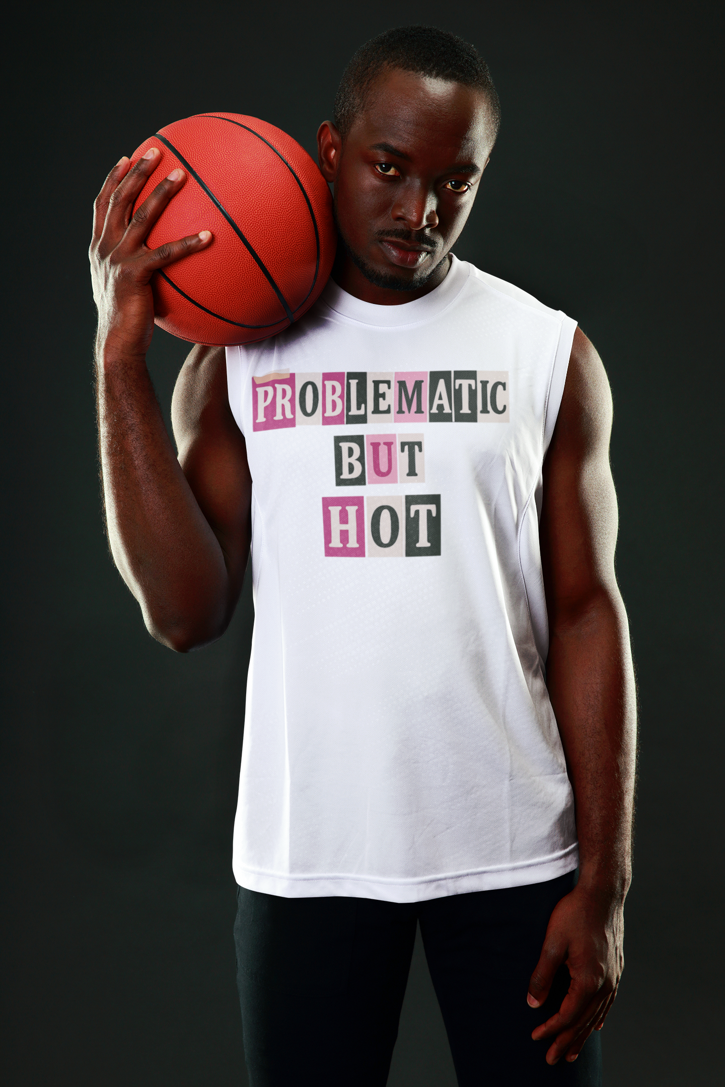 Man wearing Good Trouble Garments white sleeveless problematic but hot t-shirt holding a basketball