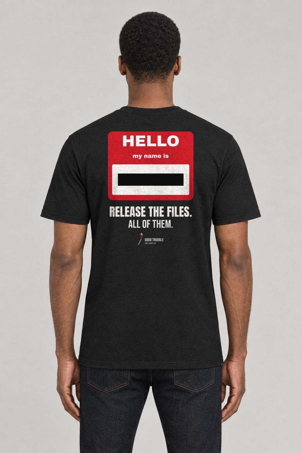 Redacted Name Tag Epstein Files Tee in Black, back view showing the redacted HELLO my name is back print, on an athletic model wearing size L, 6'0" - Good Trouble Fashion