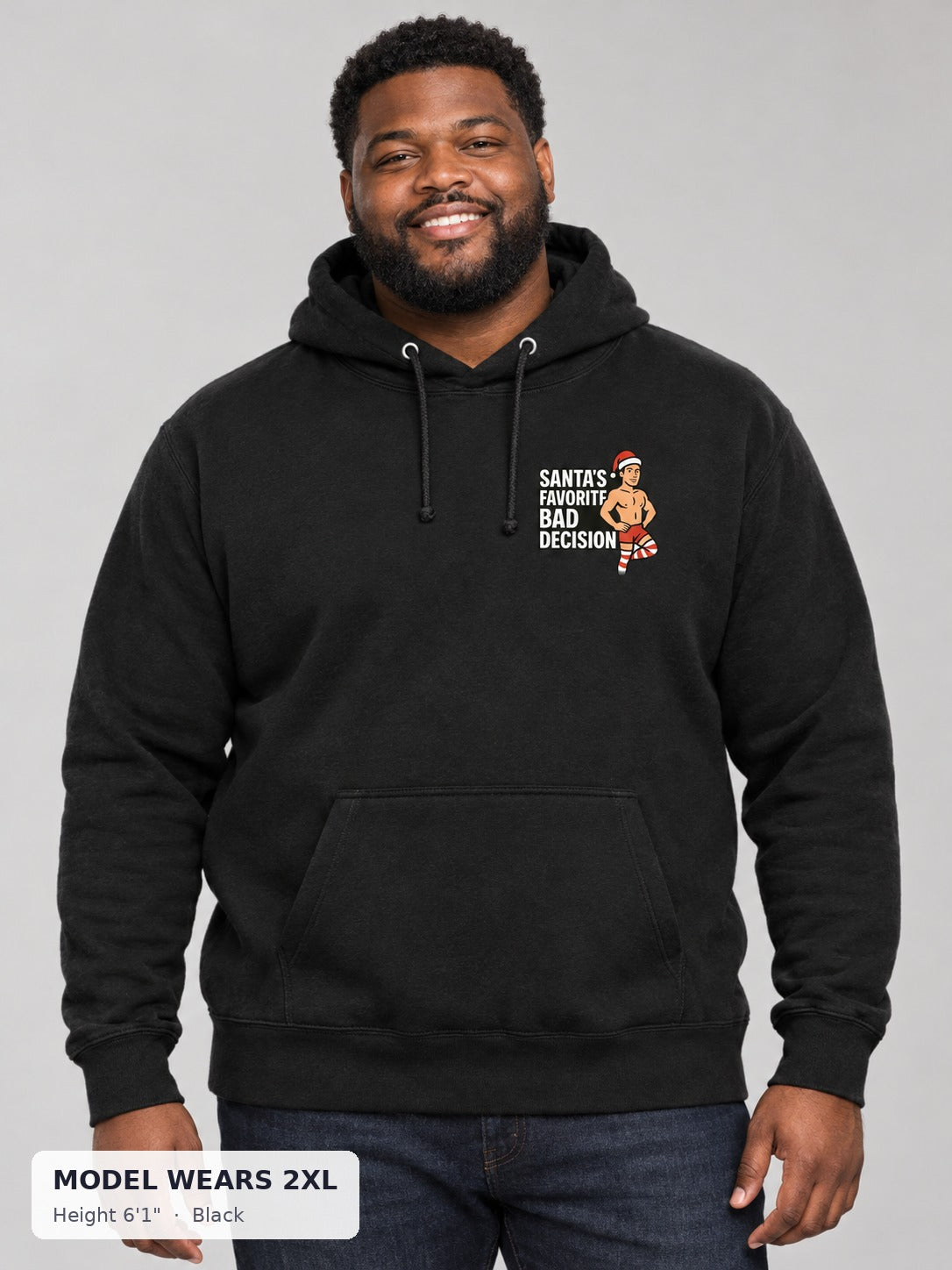 Santa's Favorite Bad Decision Hoodie in Black on a plus-size model wearing size 2XL, 6'1" - Good Trouble Fashion