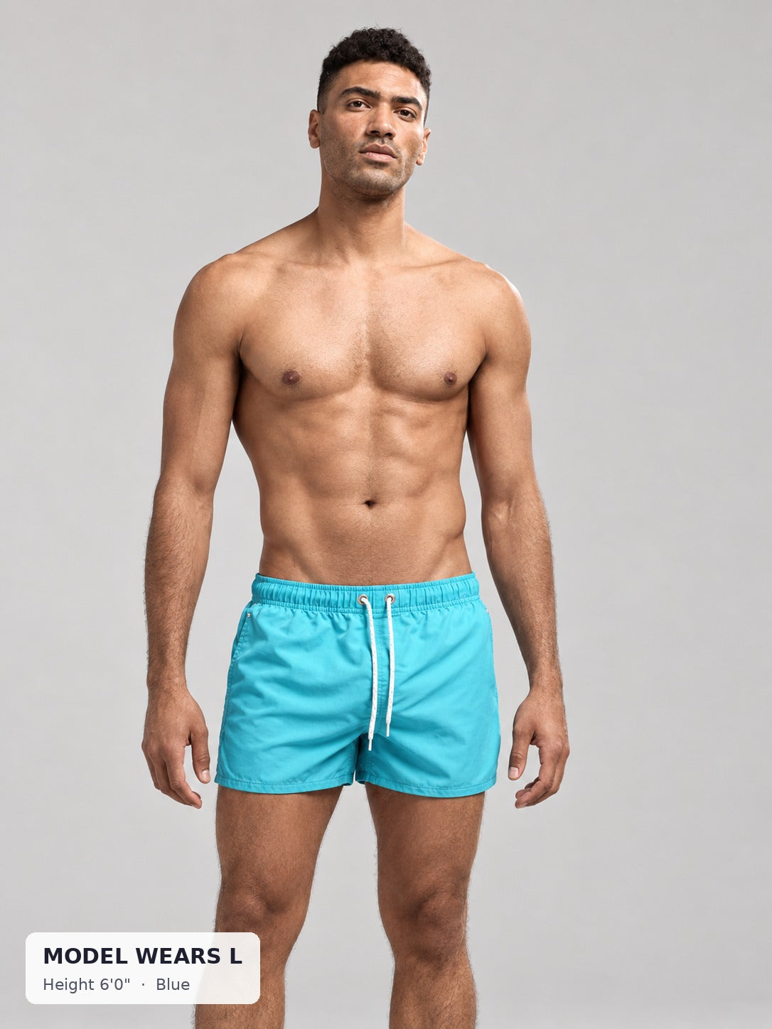 CODE 22 Drawstring Swim Shorts in Blue on an athletic model wearing size L, 6'0"
