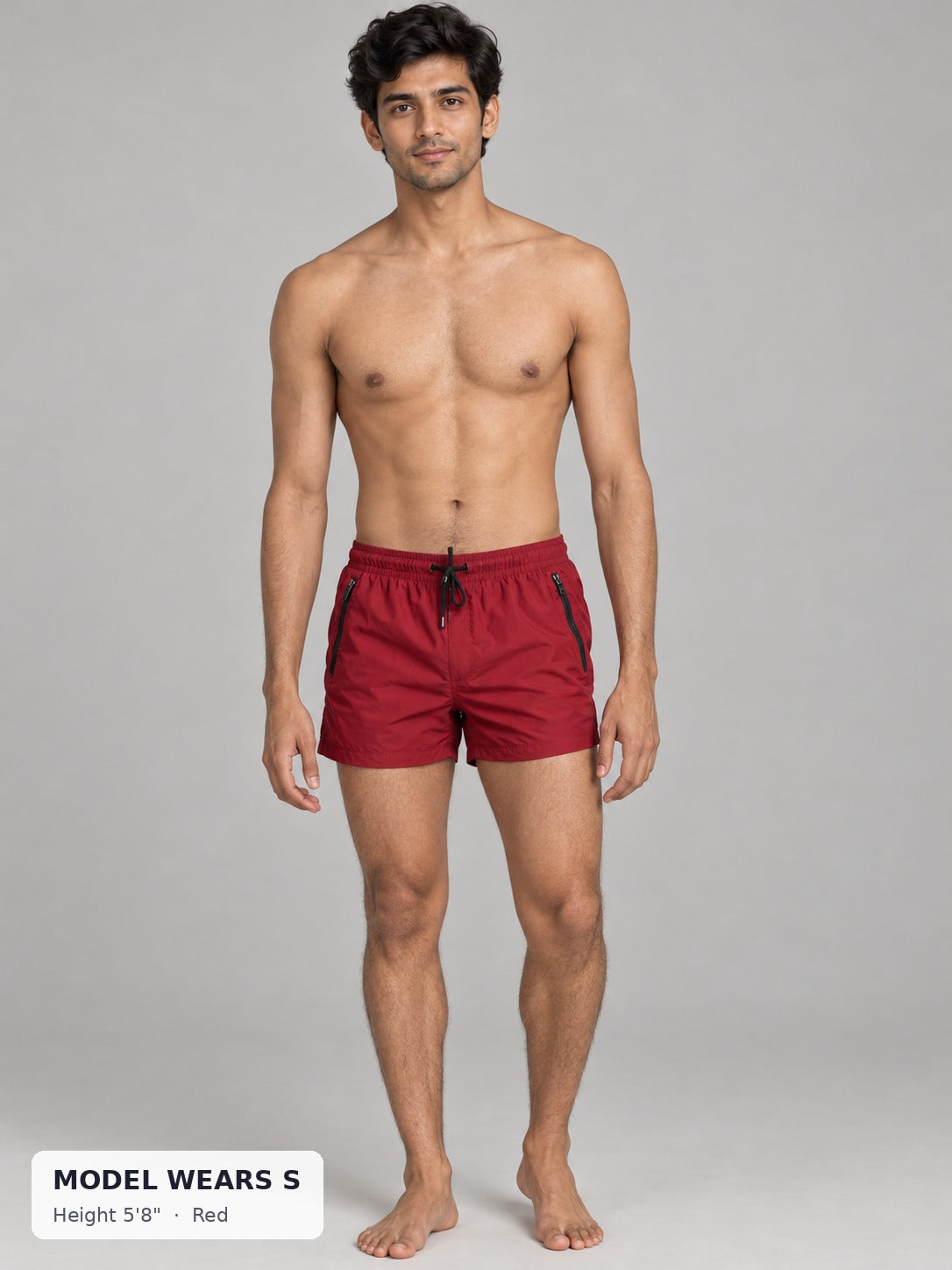 CODE 22 Solid Swim Trunks in Red on a slim model wearing size S, 5'8"