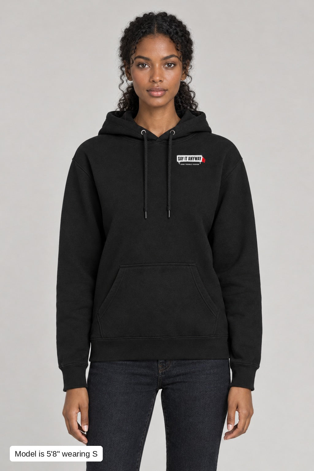 They Can't Censor All of Us Hoodie in Black, front, left-chest SAY IT ANYWAY censor bar print, on a slim model wearing size S, 5'8" - Good Trouble Fashion