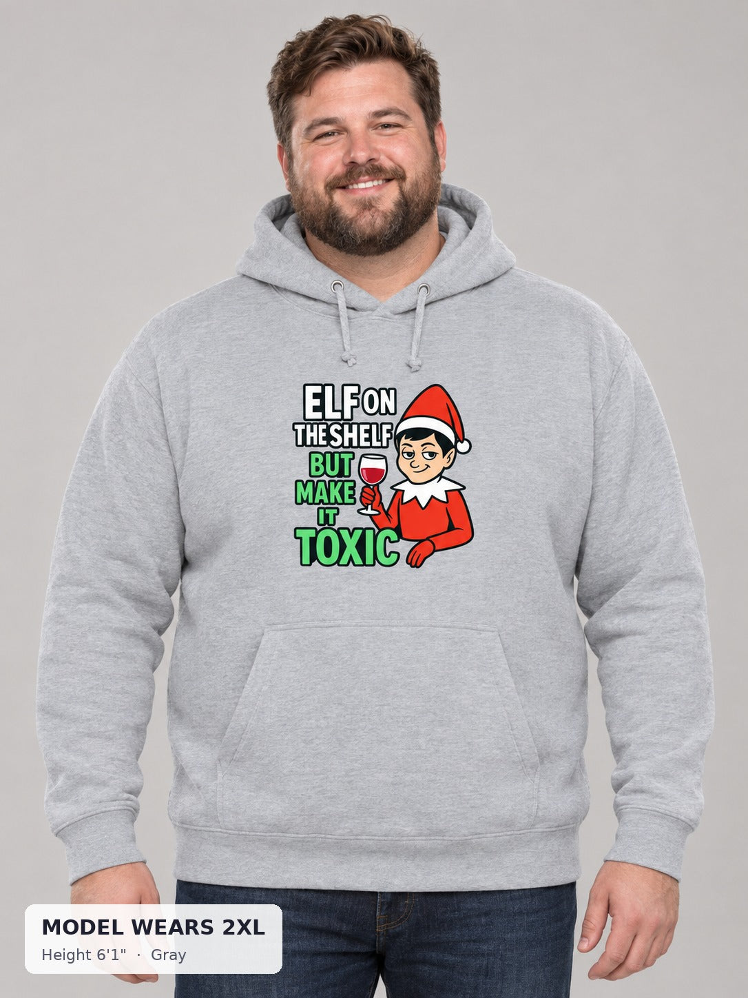 Toxic Elf on the Shelf Hoodie in Gray on a plus-size model wearing size 2XL, 6'1" - Good Trouble Fashion