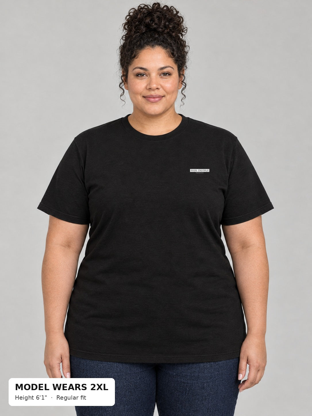 Unapologetic Pride Tee in Black, front, Good Trouble Fashion left-chest label, on a plus-size model wearing size 2XL, 6'1" - Good Trouble Fashion