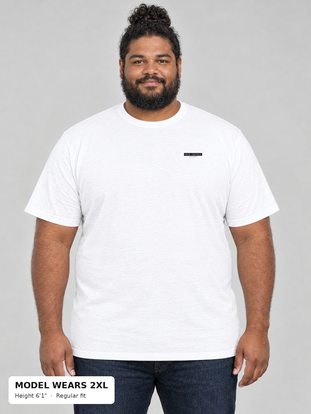 Unapologetic Pride Tee in White, front, Good Trouble Fashion left-chest label, on a plus-size model wearing size 2XL, 6'1" - Good Trouble Fashion