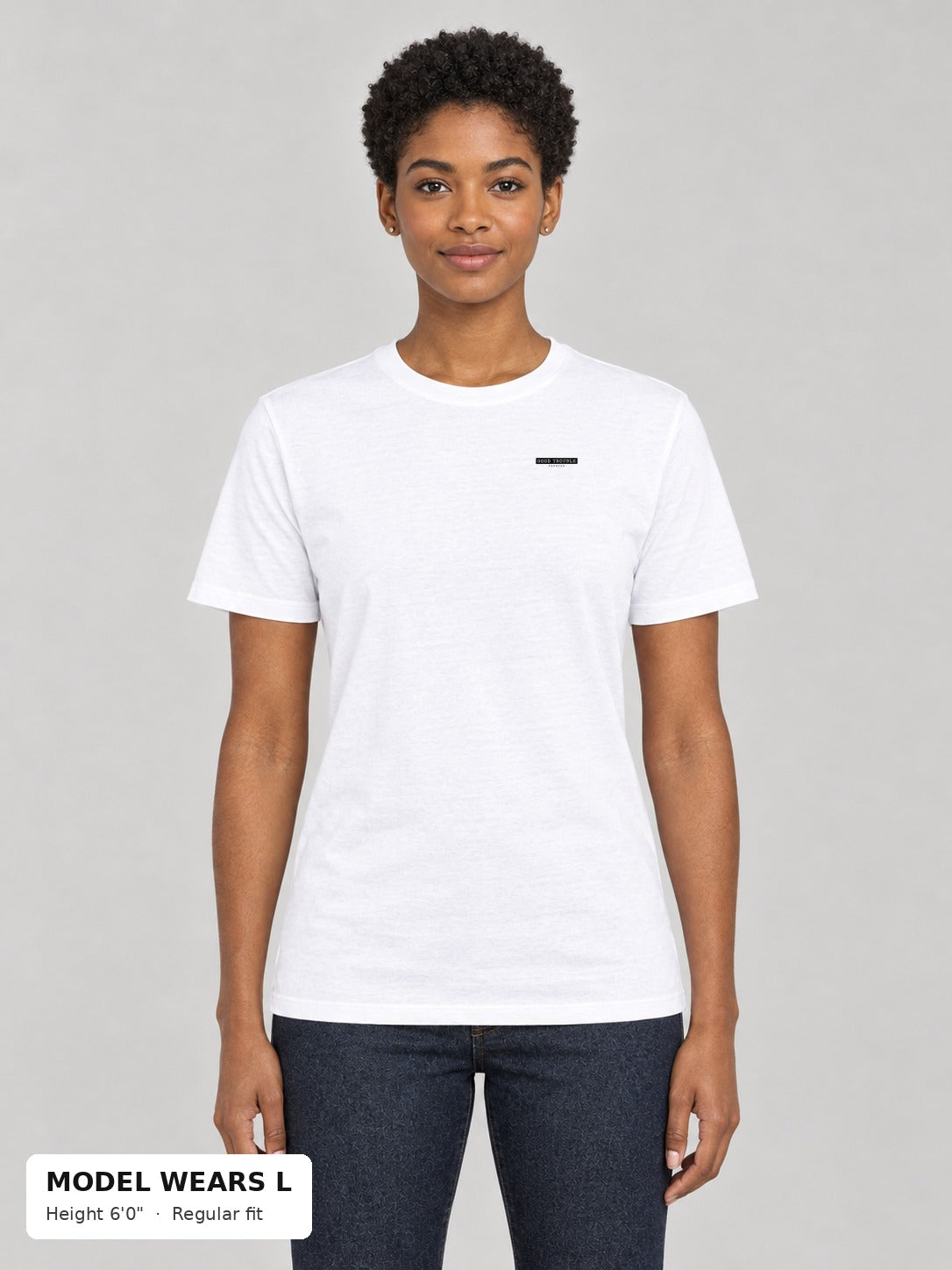Unapologetic Pride Tee in White, front, Good Trouble Fashion left-chest label, on an athletic model wearing size L, 6'0" - Good Trouble Fashion