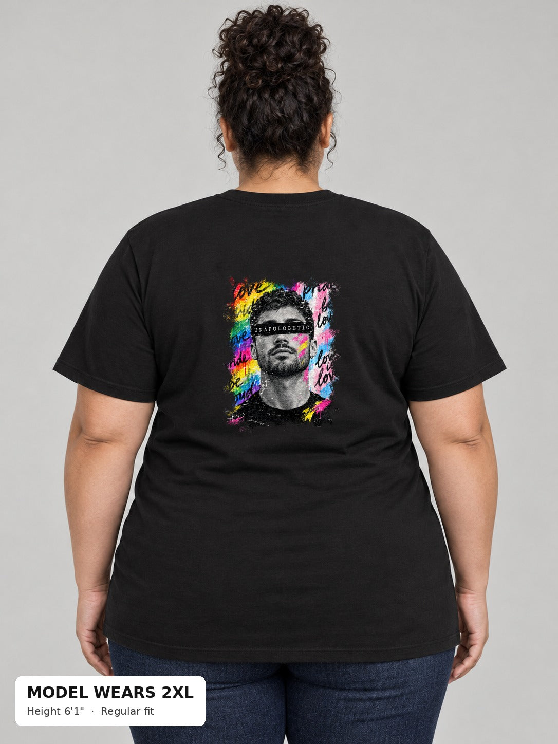 Unapologetic Pride Tee in Black, back, Unapologetic bearded man portrait print, on a plus-size model wearing size 2XL, 6'1" - Good Trouble Fashion