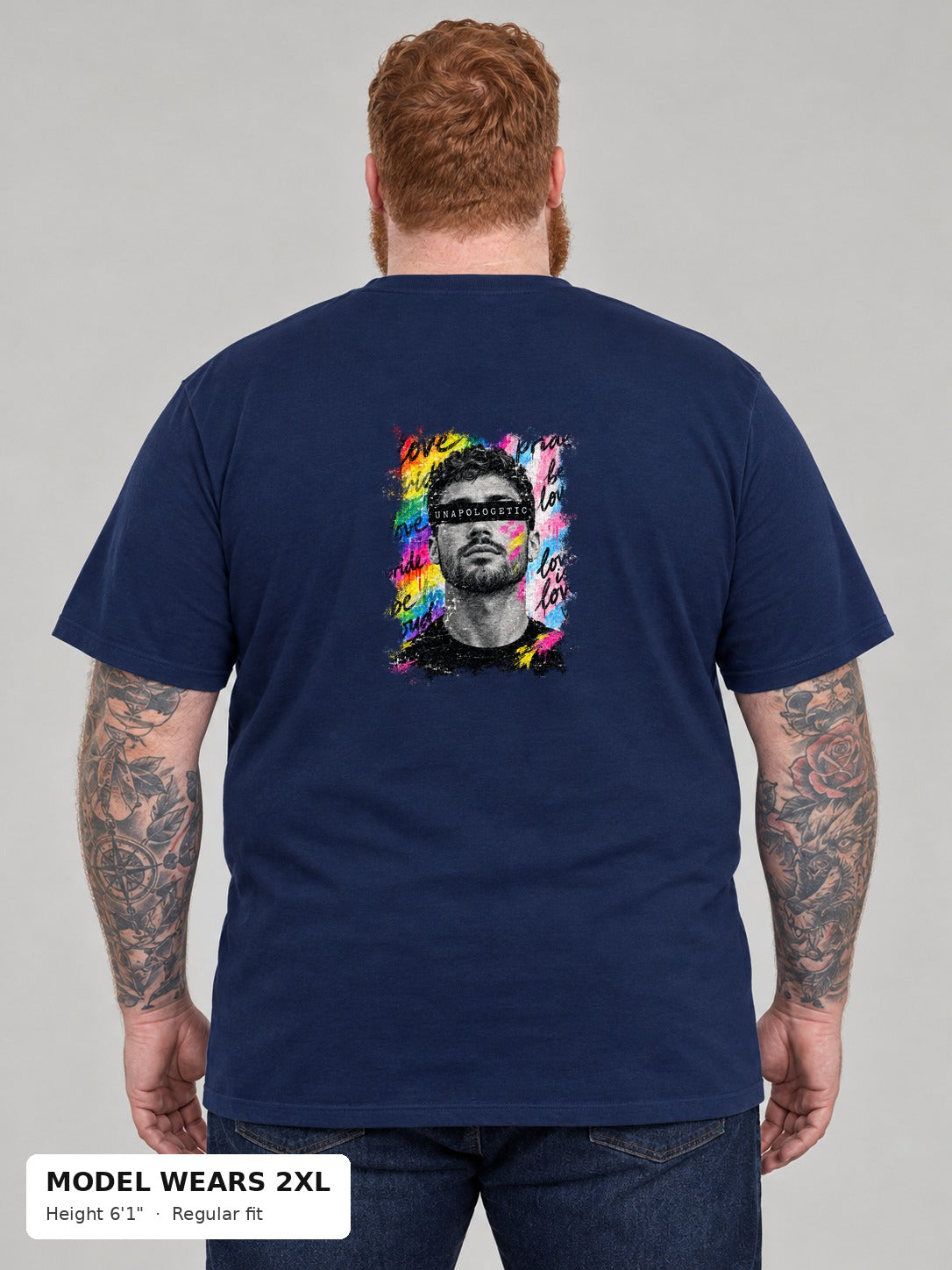 Unapologetic Pride Tee in Navy, back, Unapologetic bearded man portrait print, on a plus-size model wearing size 2XL, 6'1" - Good Trouble Fashion