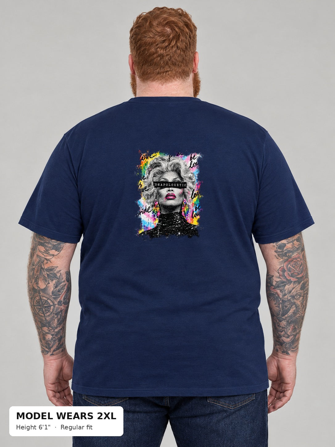 Unapologetic Pride Tee in Navy, back, Unapologetic drag queen portrait print, on a plus-size model wearing size 2XL, 6'1" - Good Trouble Fashion