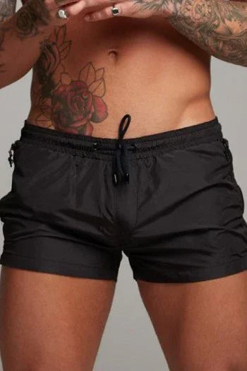 Good Trouble Garments short sexy swim trunks in black with drawstring waist for men