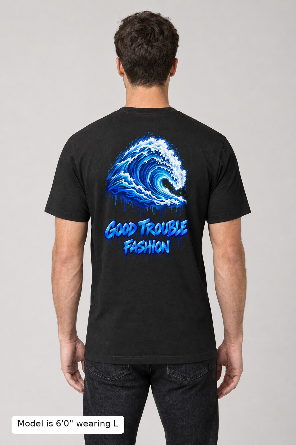 VOTE Blue Wave Tee in Black, back, blue wave and Good Trouble Fashion print, on an athletic model wearing size L, 6'0" - Good Trouble Fashion